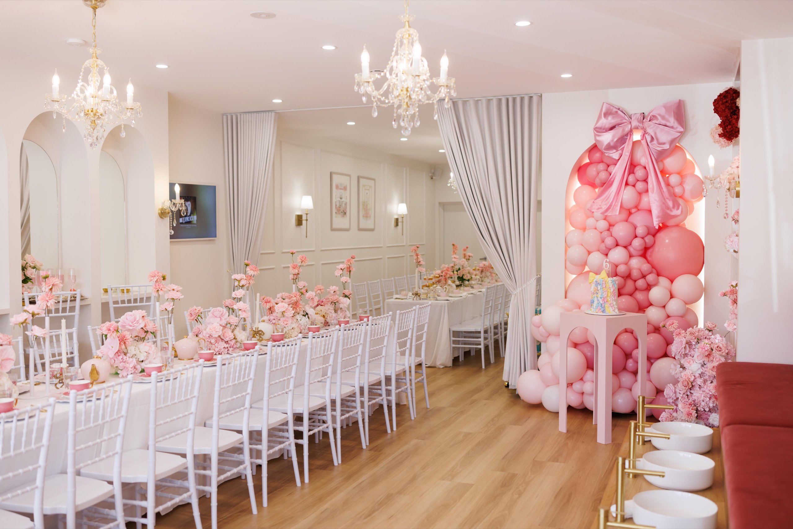 A party table styled in pink and white